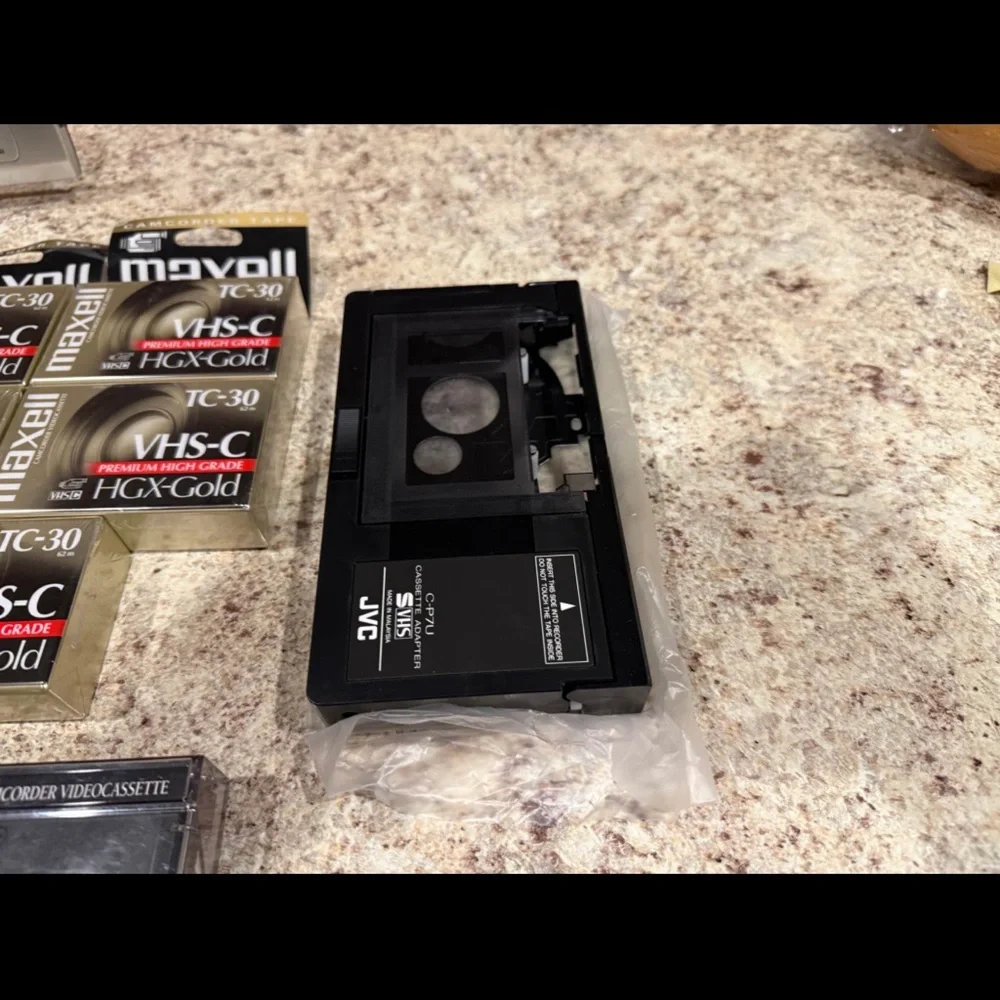 JVC Gray Camcorder with VHS-C Tapes